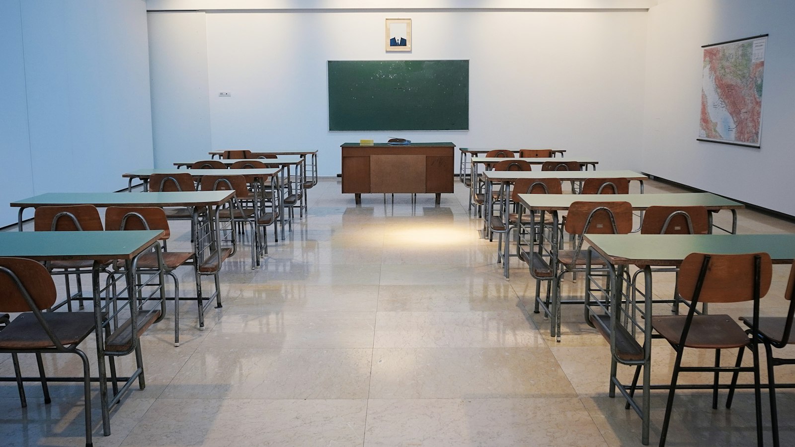 Teacher supporting American students in a caring learning environment